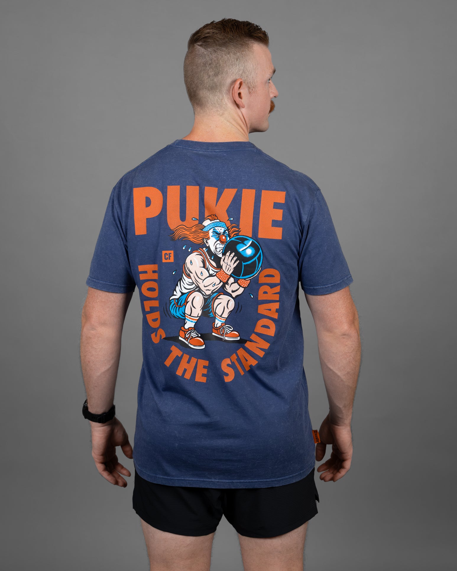 Pukie Holds The Standard Tee